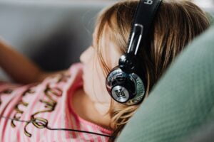 young girl listening to audiobook